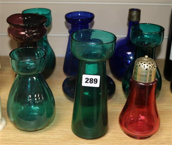 A Bristol blue decanter, a cranberry glass sifter and seven hyacinth bulb vases